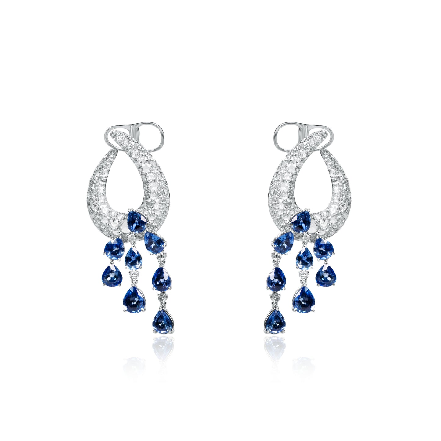 Pair of 18K white gold chandelier earrings featuring diamond pavé loops and cascading pear-shaped natural blue sapphire drops.