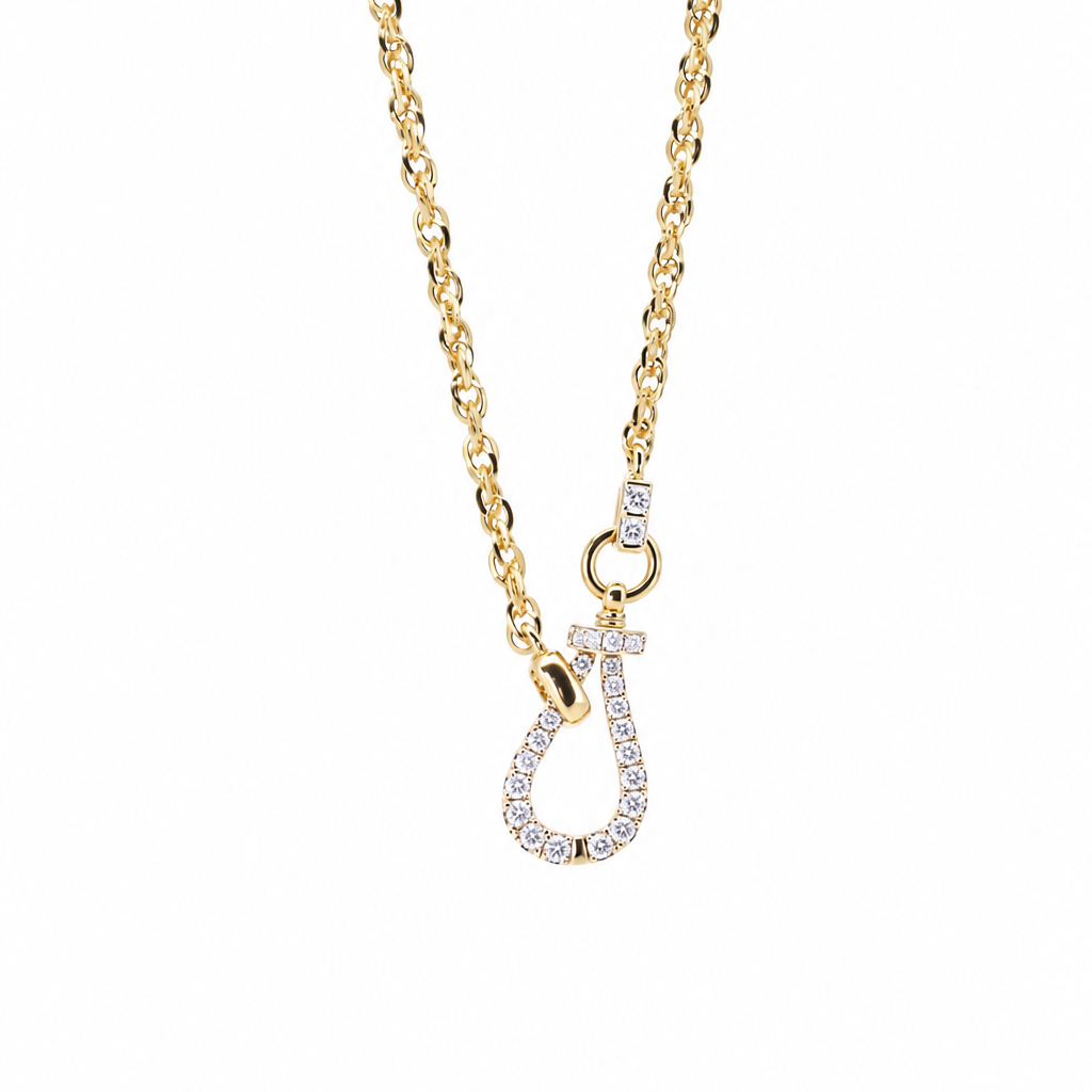 18K yellow gold link chain necklace featuring a diamond pavé horseshoe-shaped versatile clasp lock, isolated on a white background.