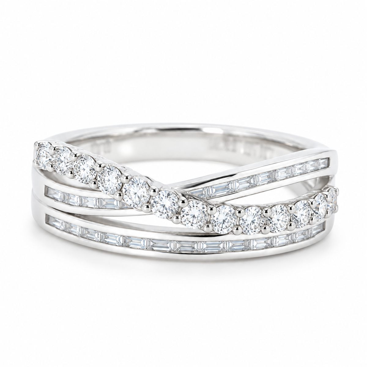 18K white gold crossover ring with two rows of channel-set baguette diamonds and a sweeping row of round natural diamonds.