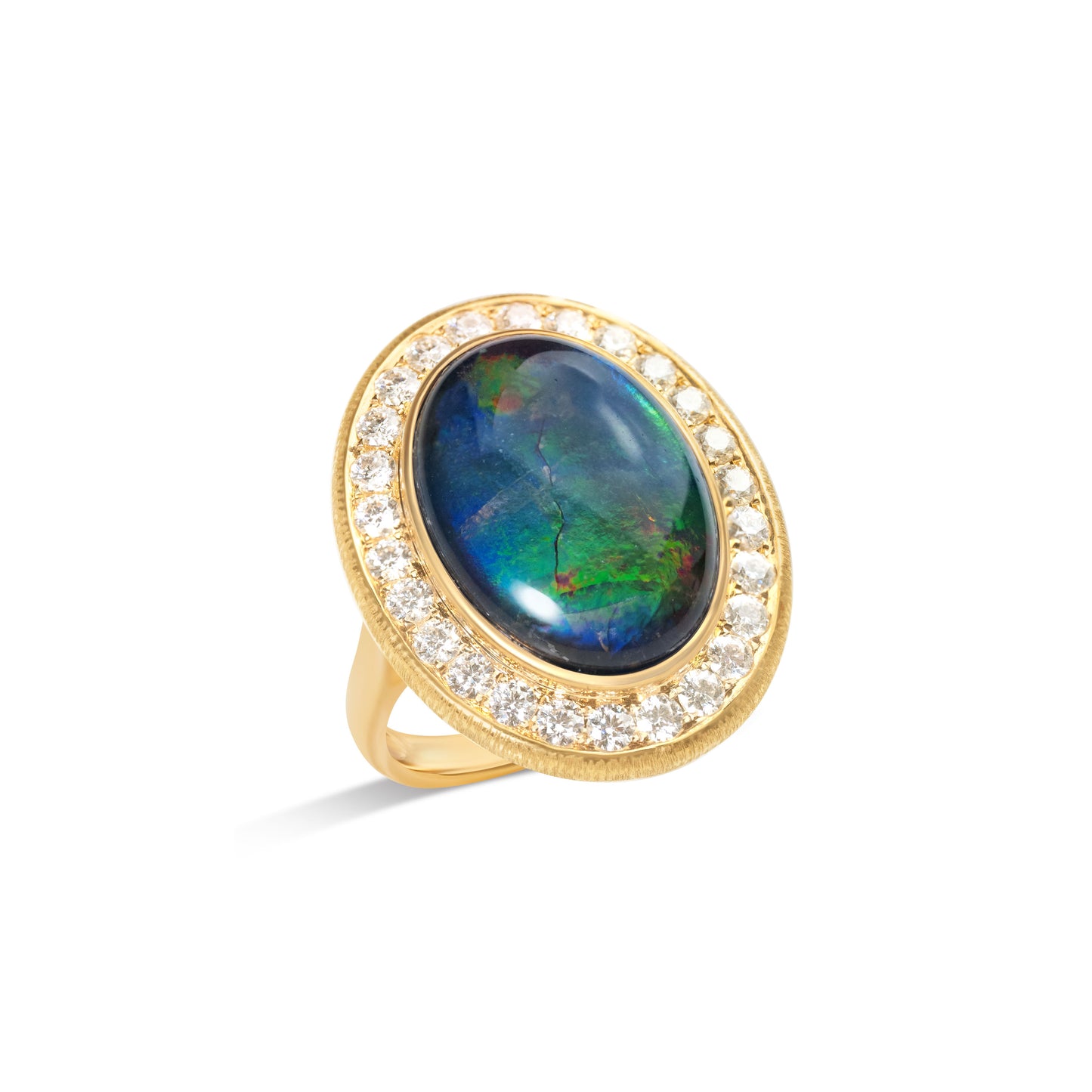Natural ammolite halo ring with diamond surround by Fantasilvia Fine Jewelry.