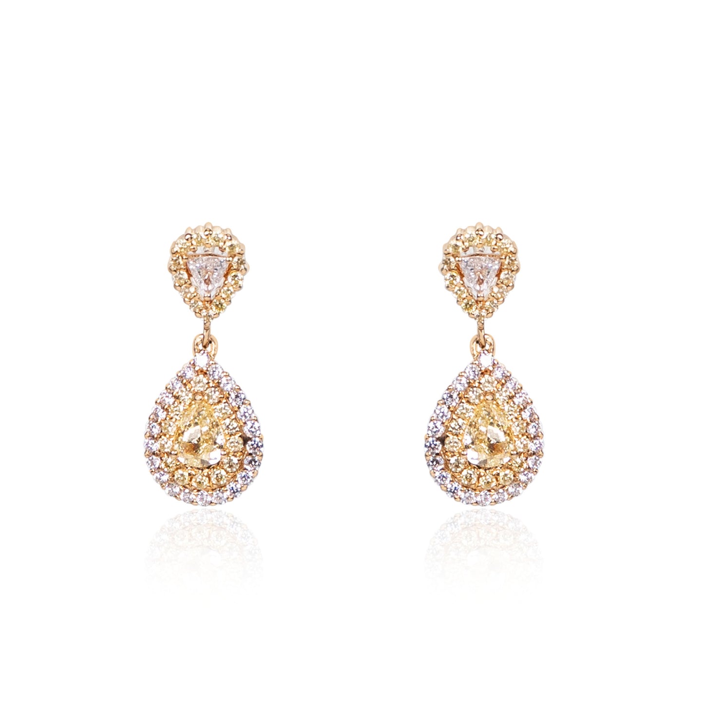 Natural fancy yellow diamond teardrop earrings in fine gold by Fantasilvia Fine Jewelry.