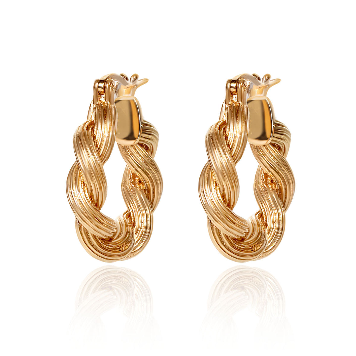 18K gold Assisi twist huggie earrings crafted by Fantasilvia Fine Jewelry.