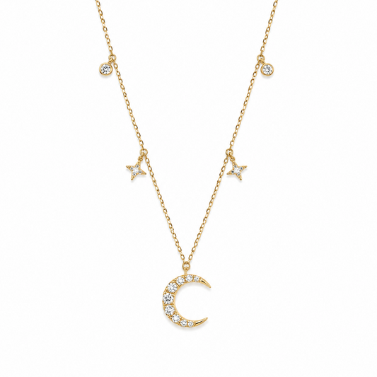 Natural diamond necklace in 18K yellow gold with a crescent moon pendant, two star charms and two bezel-set diamond accents.