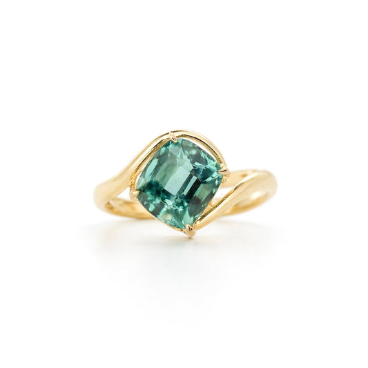3.225 carat cushion-cut Afghan Lagoon Tourmaline ring in a modern 14K yellow gold bypass setting.