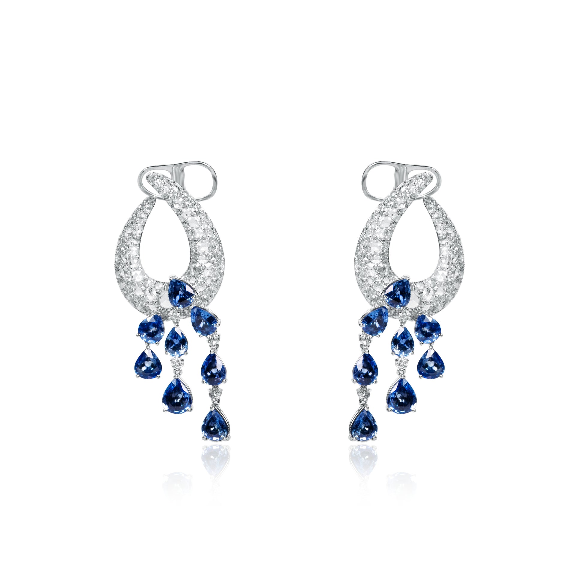 Pair of 18K white gold chandelier earrings featuring diamond pavé loops and cascading pear-shaped natural blue sapphire drops.
