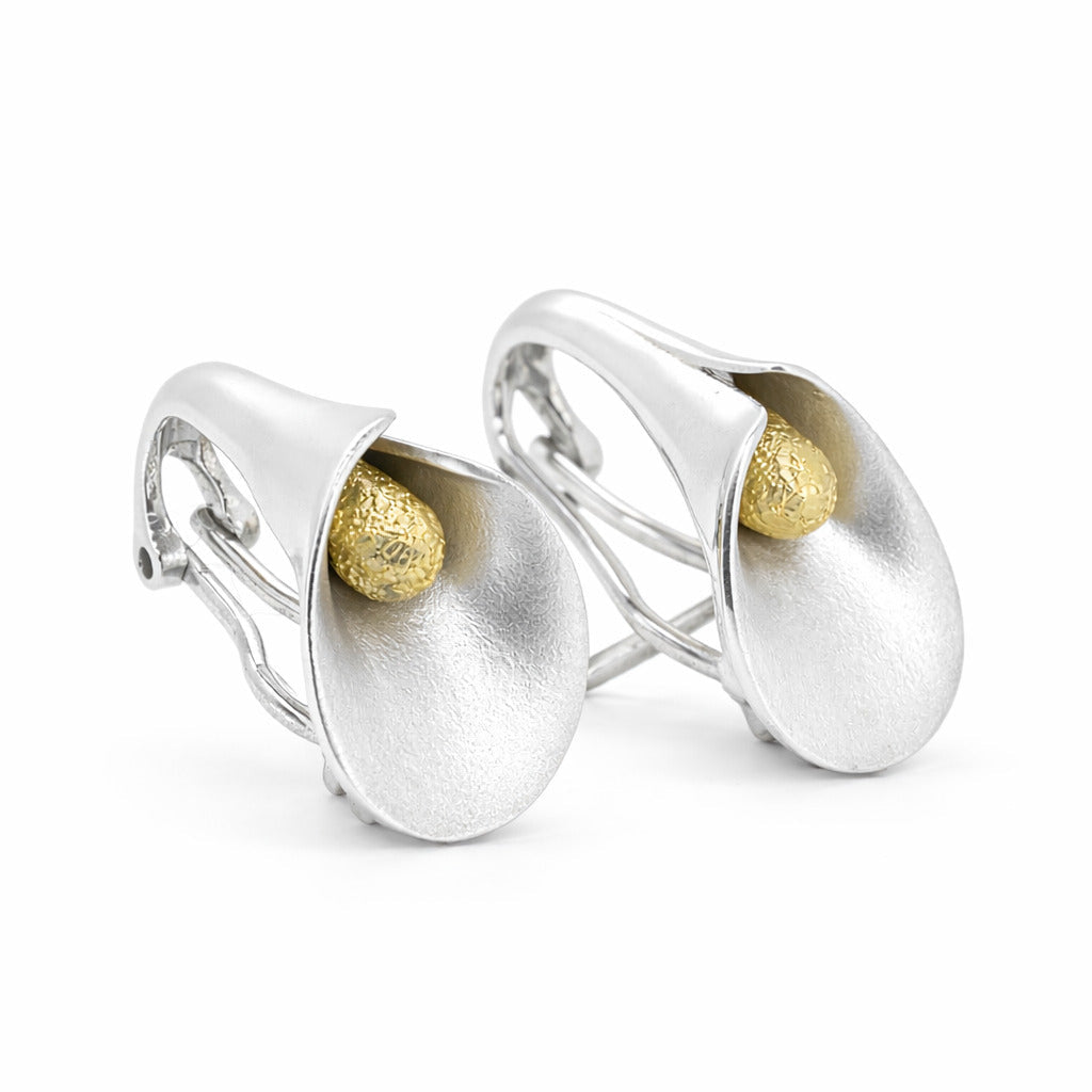 Sculptural silver l calla lily earrings with a brushed finish and textured silver center, matching ring available - The Pure Grac