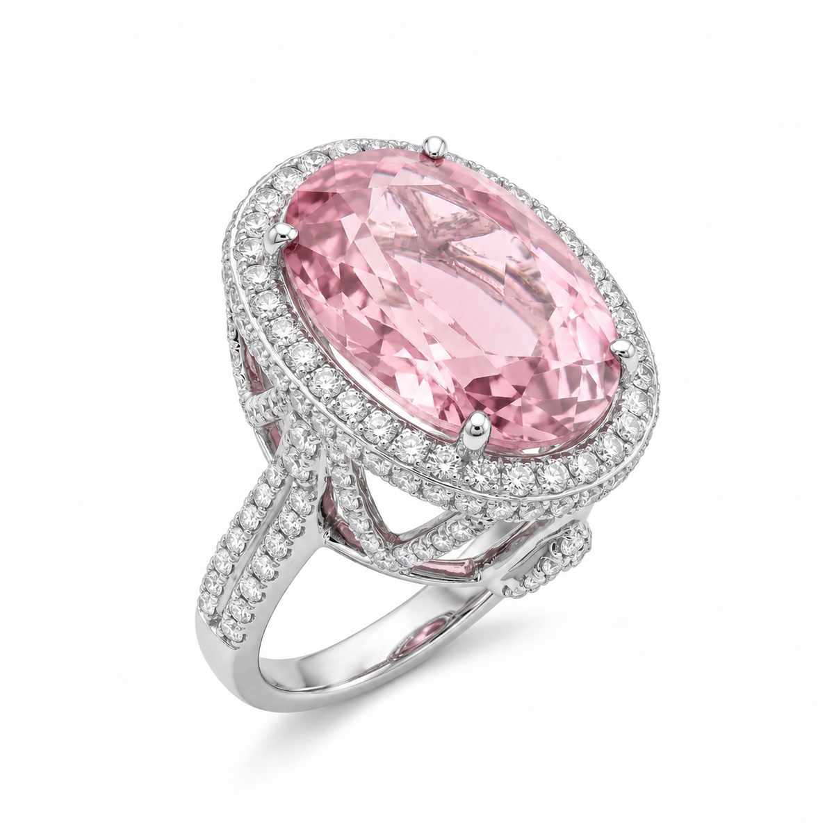 18K white gold statement ring featuring a 13.4-carat oval-cut natural pink tourmaline surrounded by a double halo of natural diamonds and a pavé diamond split-shank band.