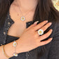 Italian silver floral bracelet featuring textured silver daisy flowers with gold-tone centers, styled with matching floral jewelry.