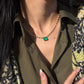 18K solid gold necklace featuring a 3.91-carat natural Colombian emerald centerpiece accented with 3.35 carats of sparkling lab-grown diamonds in an elegant graduated design.