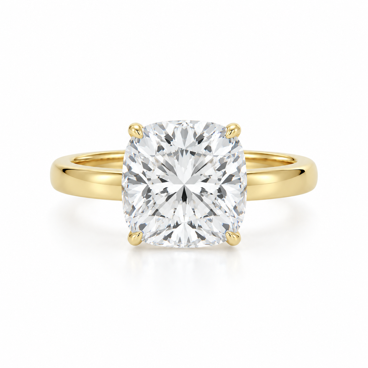 Front view of a 14K yellow gold engagement ring featuring a 3.08 carat cushion modified brilliant lab-grown diamond set in a classic four-prong solitaire setting.