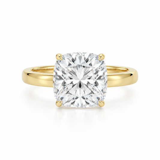 Front view of a 14K yellow gold engagement ring featuring a 3.08 carat cushion modified brilliant lab-grown diamond set in a classic four-prong solitaire setting.