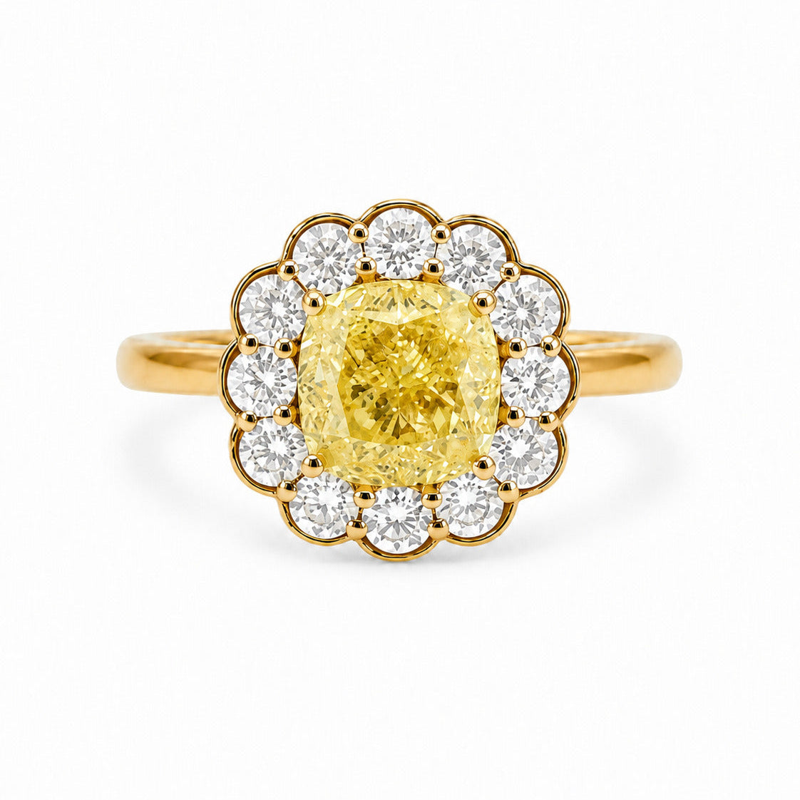 Front view of a Fantasilvia 18K yellow gold ring featuring a large cushion-cut fancy yellow diamond center stone surrounded by a flower-shaped halo of round white diamonds on a white background.