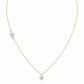 18K yellow gold necklace featuring two asymmetrical diamond-set flower charms on a fine cable chain with an adjustable spring-ring closure.