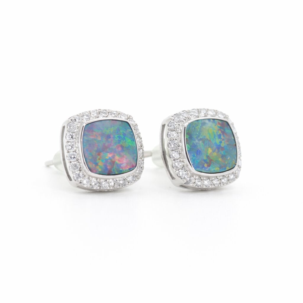 PT950 platinum stud earrings featuring a 1.433ct and 1.665ct natural opal with 0.265ct lab-diamond halos on each side.