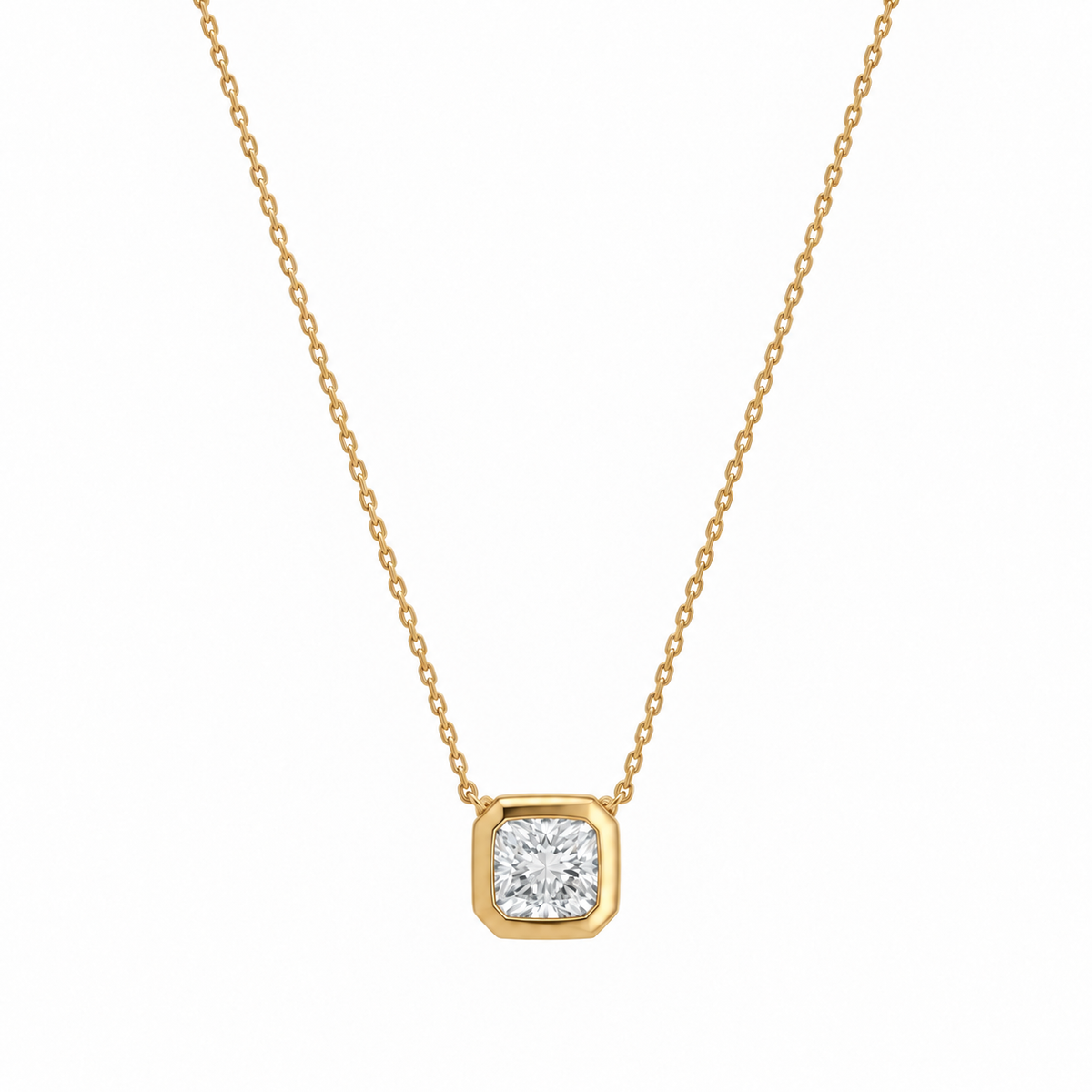 Studio shot of an 18K gold bezel set diamond necklace featuring a 1.02ct lab-grown diamond on a white background.