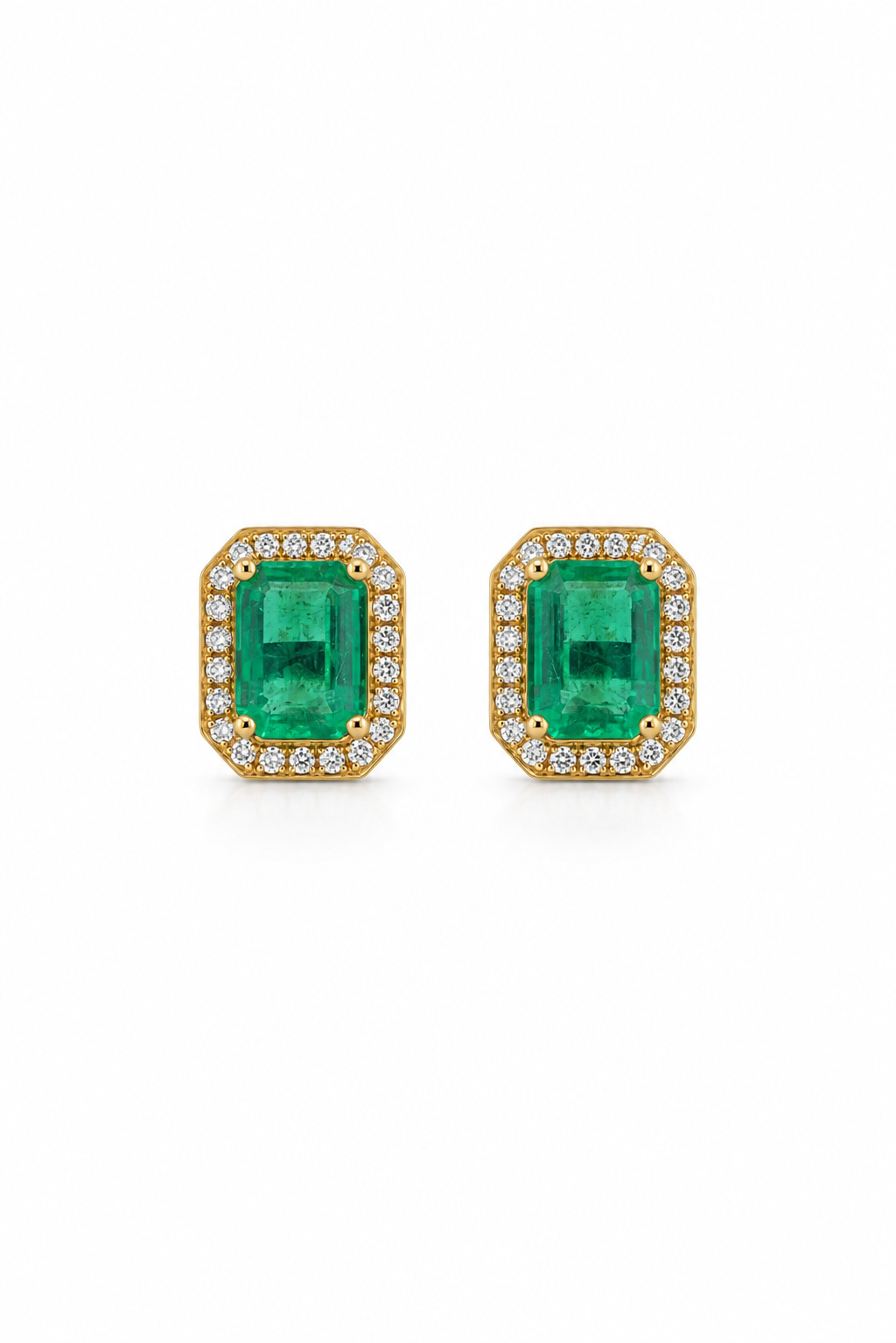 Front-facing view of a pair of 14K gold emerald and lab diamond halo stud earrings.