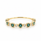 Front view of a 14K yellow gold bubble band featuring alternating bezel-set natural green tourmalines and lab-grown diamonds in a scalloped pattern.