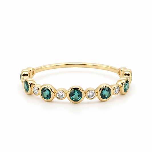 Front view of a 14K yellow gold bubble band featuring alternating bezel-set natural green tourmalines and lab-grown diamonds in a scalloped pattern.