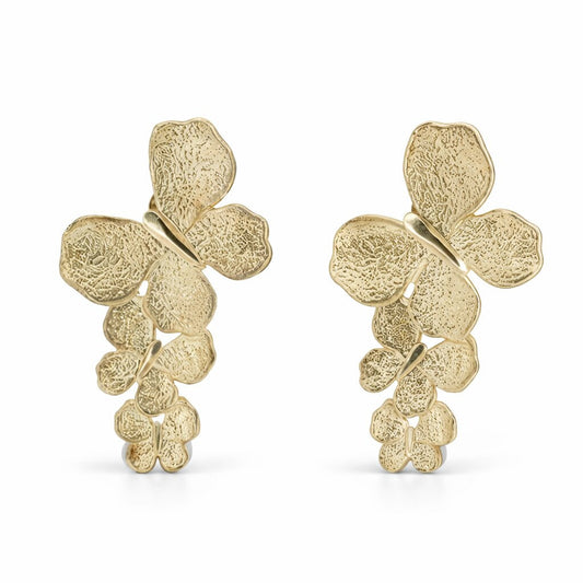 Pair of triple-butterfly drop earrings in 18K gold vermeil featuring a hand-hammered, textured finish.
