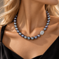 South Sea grey pearl necklace featuring 11–13 mm naturally lustrous pearls with cool steely overtones, finished with an elegant diamond-accented clasp.