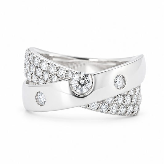 Front view of a platinum natural diamond crossover ring with three round diamond accents and a pavé diamond band.