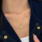 18K solid gold pendant necklace featuring a pear-cut natural yellow diamond center surrounded by natural colorless and fancy yellow diamond halos, finished with a trillion-style diamond accent and fine gold chain.