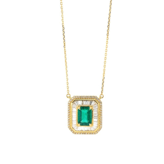 18K yellow gold vintage inspired necklace featuring an emerald-cut emerald with a double halo of baguette and round diamonds