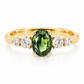 A front close-up view of a 14K yellow gold five-stone ring, showcasing a 1-carat oval natural teal sapphire at the center, flanked by four graduated round natural colorless diamonds (3mm and 2mm) in a symmetrical prong setting on a white background.