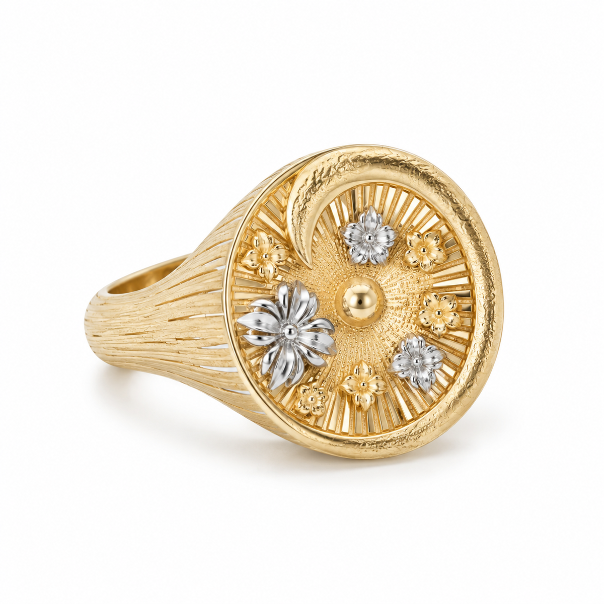 Angled view of the gold vermeil Giardino Segreto ring, showcasing the wide, striated textured band and intricate two-tone floral detailing on the central dome.