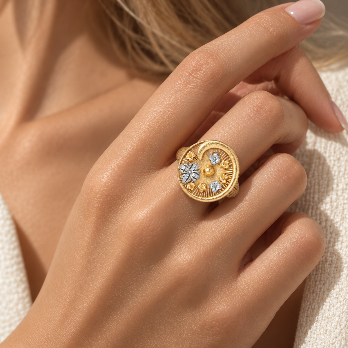 Italian silver statement ring featuring an ornate round medallion design with sculptural floral motifs, intricate engraved detailing, and contrasting gold-tone and silver-tone accents.