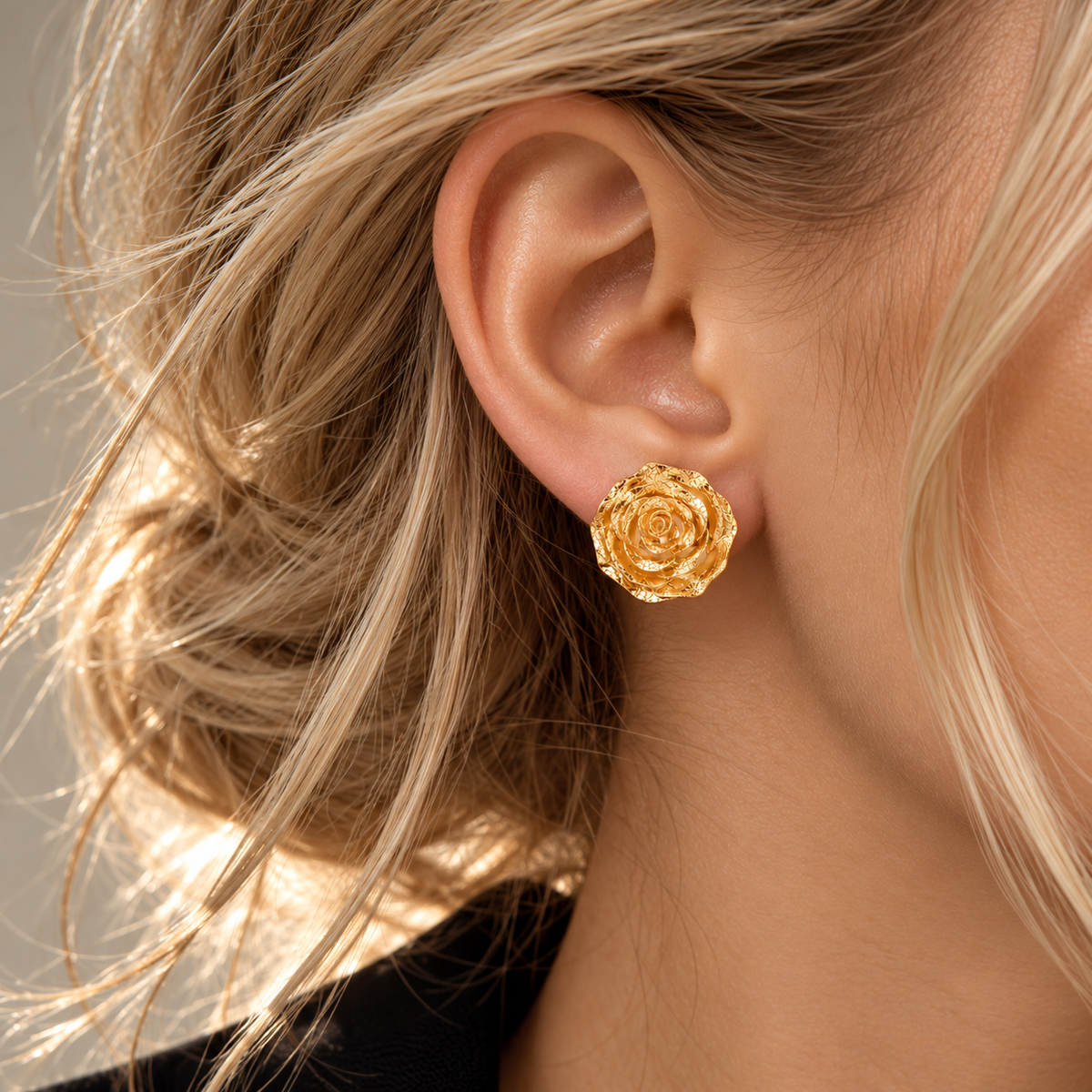 Italian silver rose stud earrings featuring a sculptural full-bloom design with richly textured layered petals and a warm golden finish.
