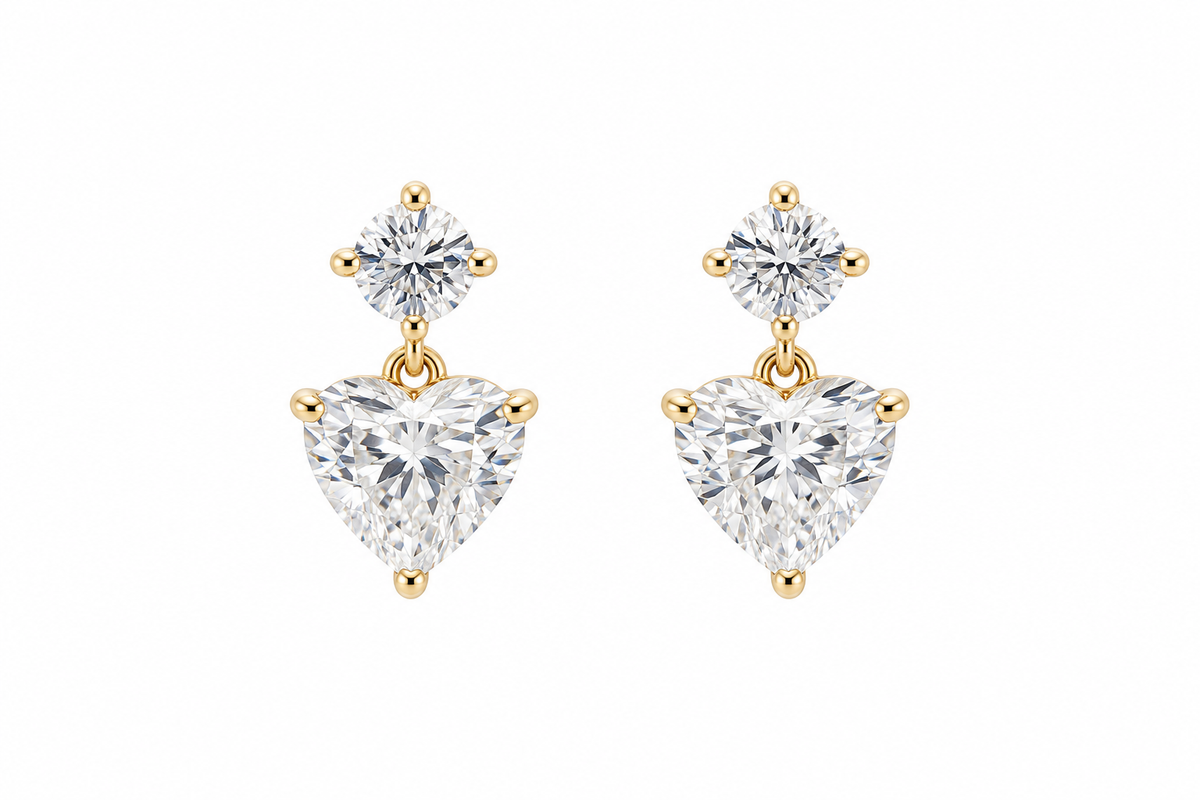 Pair of 18K yellow gold lab-grown diamond drop earrings, each featuring a round diamond stud above a heart-shaped diamond.