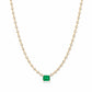 A Fantasilvia necklace featuring a central rectangular emerald-cut emerald suspended from a continuous strand of round-cut diamonds in 18K yellow gold settings on a white background.