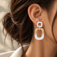 18K yellow gold statement drop earrings featuring luminous mother-of-pearl links accented with sparkling natural colorless diamonds in a bold geometric design.