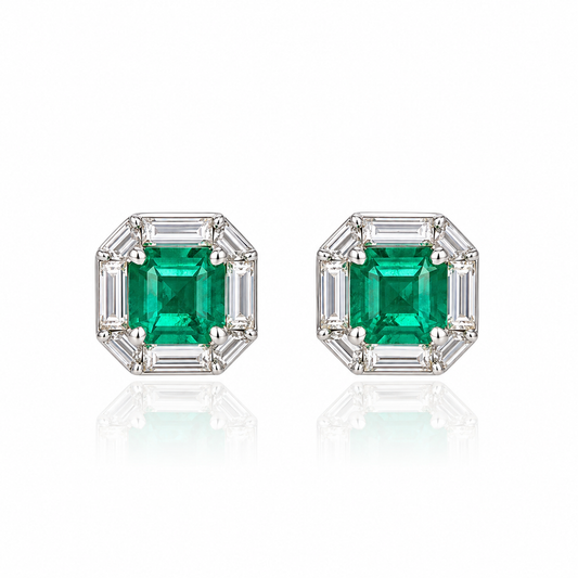 18K white gold stud earrings featuring natural Panjshir emeralds surrounded by geometric lab-grown diamonds in an elegant octagonal halo design.