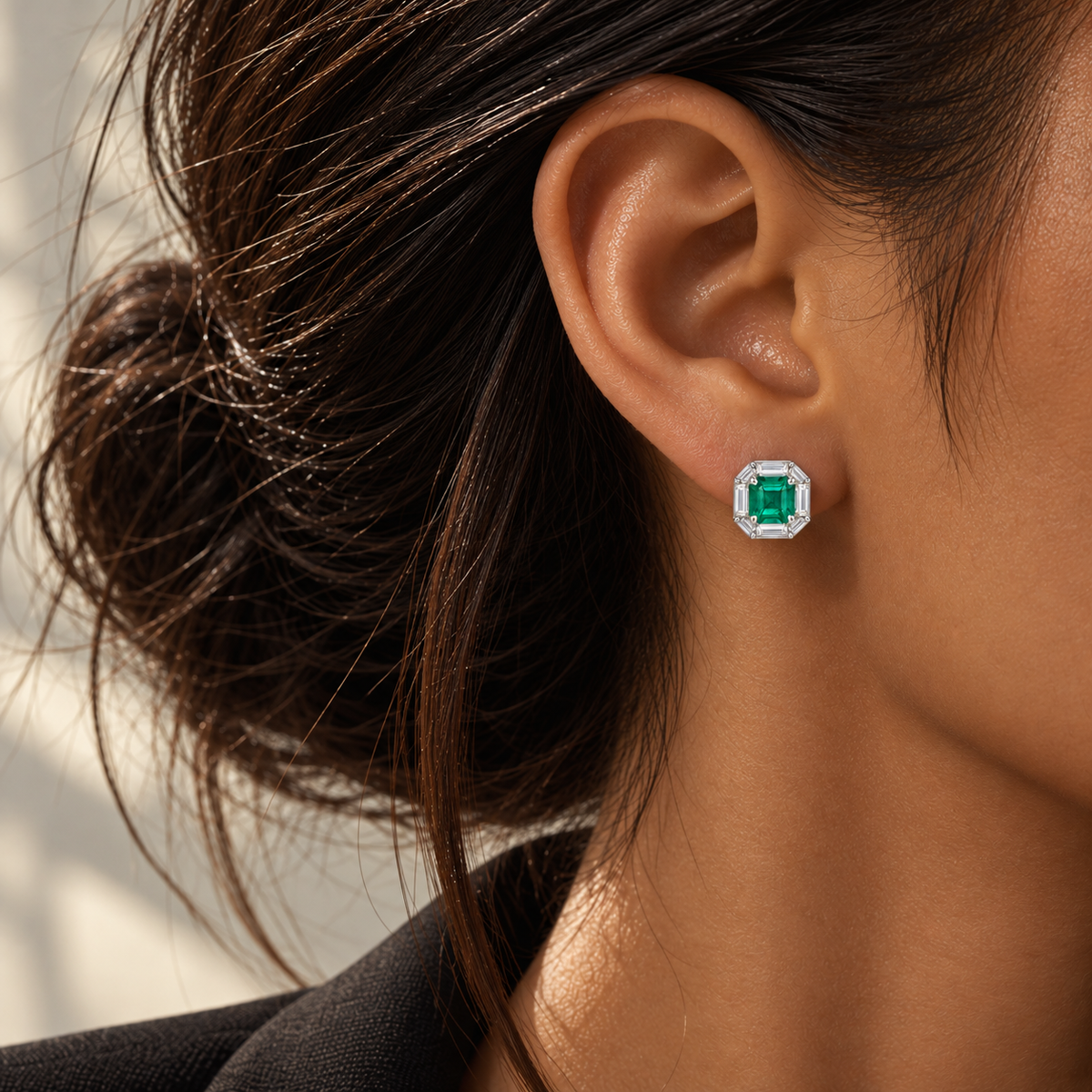 18K white gold emerald stud earrings featuring natural emerald center stones surrounded by geometric lab-grown diamonds in an elegant octagonal halo design.