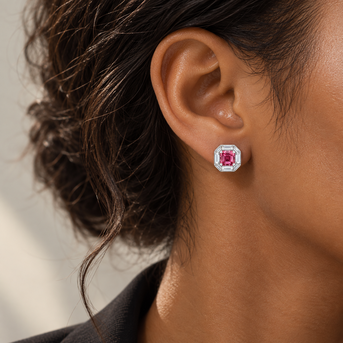 18K white gold stud earrings featuring natural pink tourmaline center stones surrounded by lab-grown baguette-cut diamonds in a refined octagonal halo design, styled on the ear.