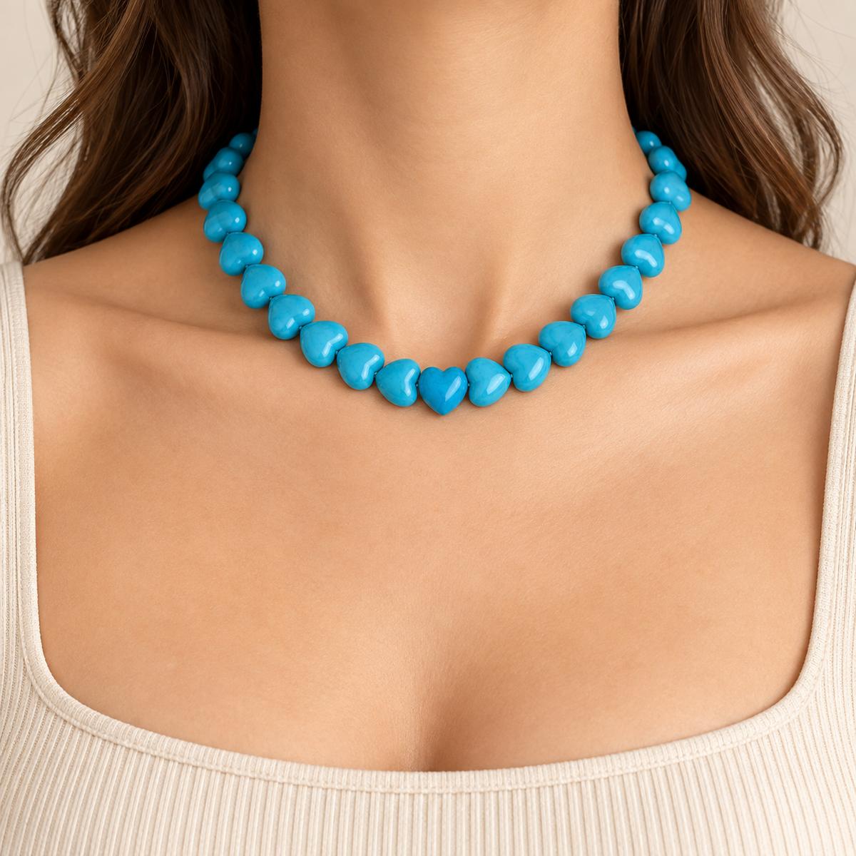 Natural turquoise heart-shaped bead necklace featuring vibrant blue turquoise and an 18K gold vermeil heart clasp in a bold statement design.