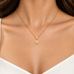 18K solid gold pendant necklace featuring a pear-cut natural yellow diamond center surrounded by natural colorless and fancy yellow diamond halos, finished with a trillion-style diamond accent and fine gold chain.