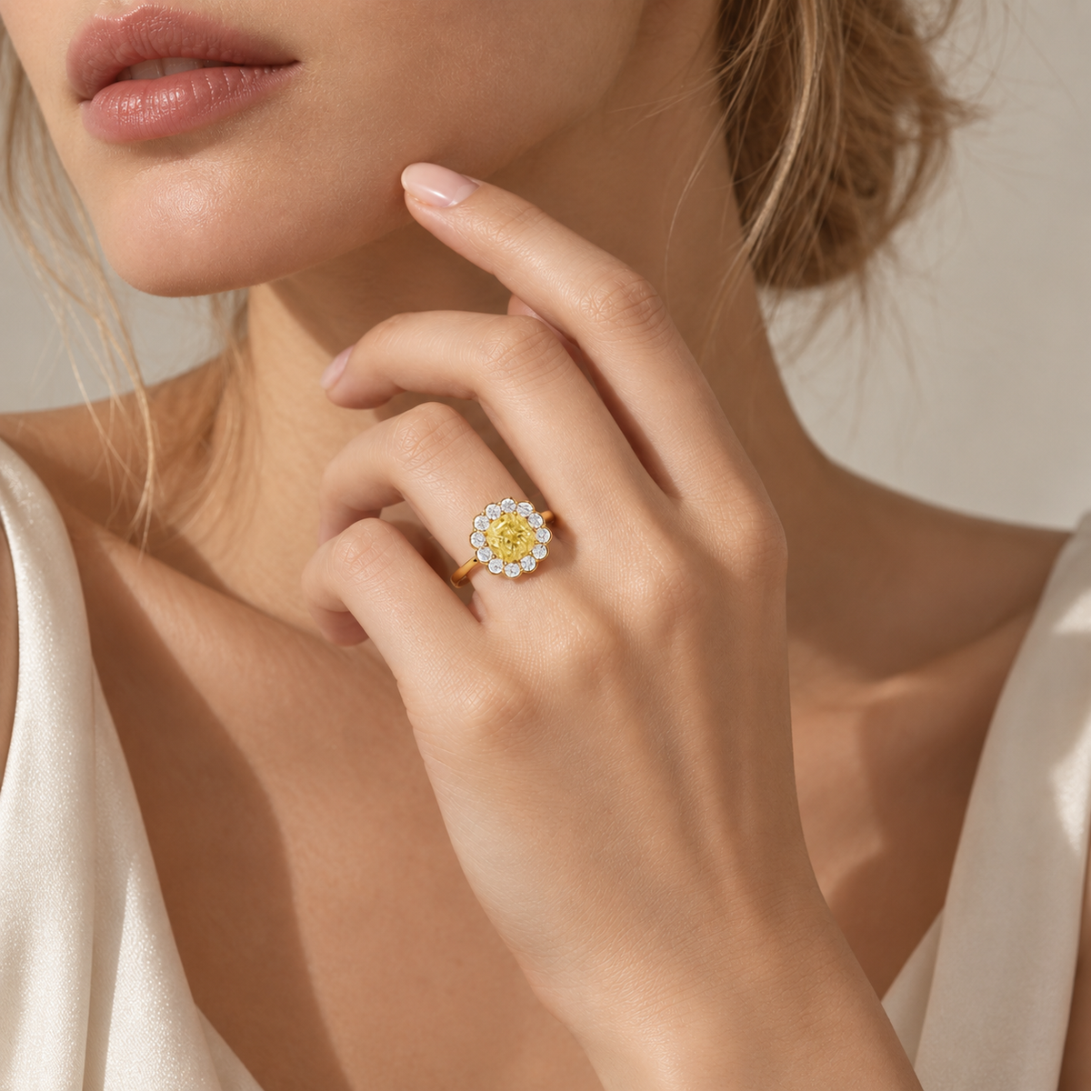 18K gold natural diamond ring featuring a fancy intense yellow center diamond surrounded by a halo of round brilliant-cut white diamonds in a classic statement design.
