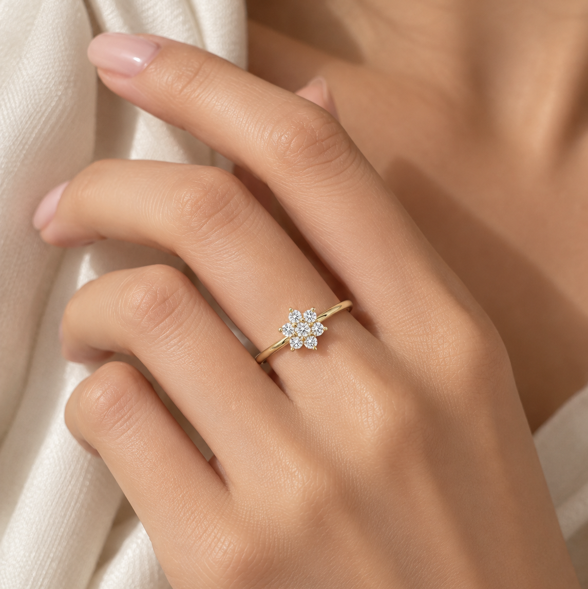 18K gold natural diamond flower ring featuring a delicate floral cluster of round brilliant-cut diamonds on a slim polished gold band.