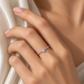 18K white gold natural diamond ring featuring a pear-shaped center diamond with round brilliant-cut diamonds pavé-set along the slim band.