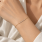 18K gold lab-grown diamond bracelet featuring a delicate row of round brilliant-cut diamonds set along a fine gold chain.