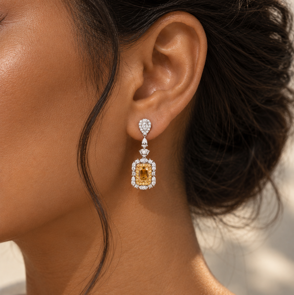 18K gold natural diamond drop earrings featuring an emerald-cut fancy yellow diamond center surrounded by sparkling white diamond halos and elegant diamond accents.