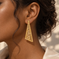 18K gold natural diamond statement earrings featuring an elongated triangular openwork design with intricate geometric details and sparkling diamond accents.