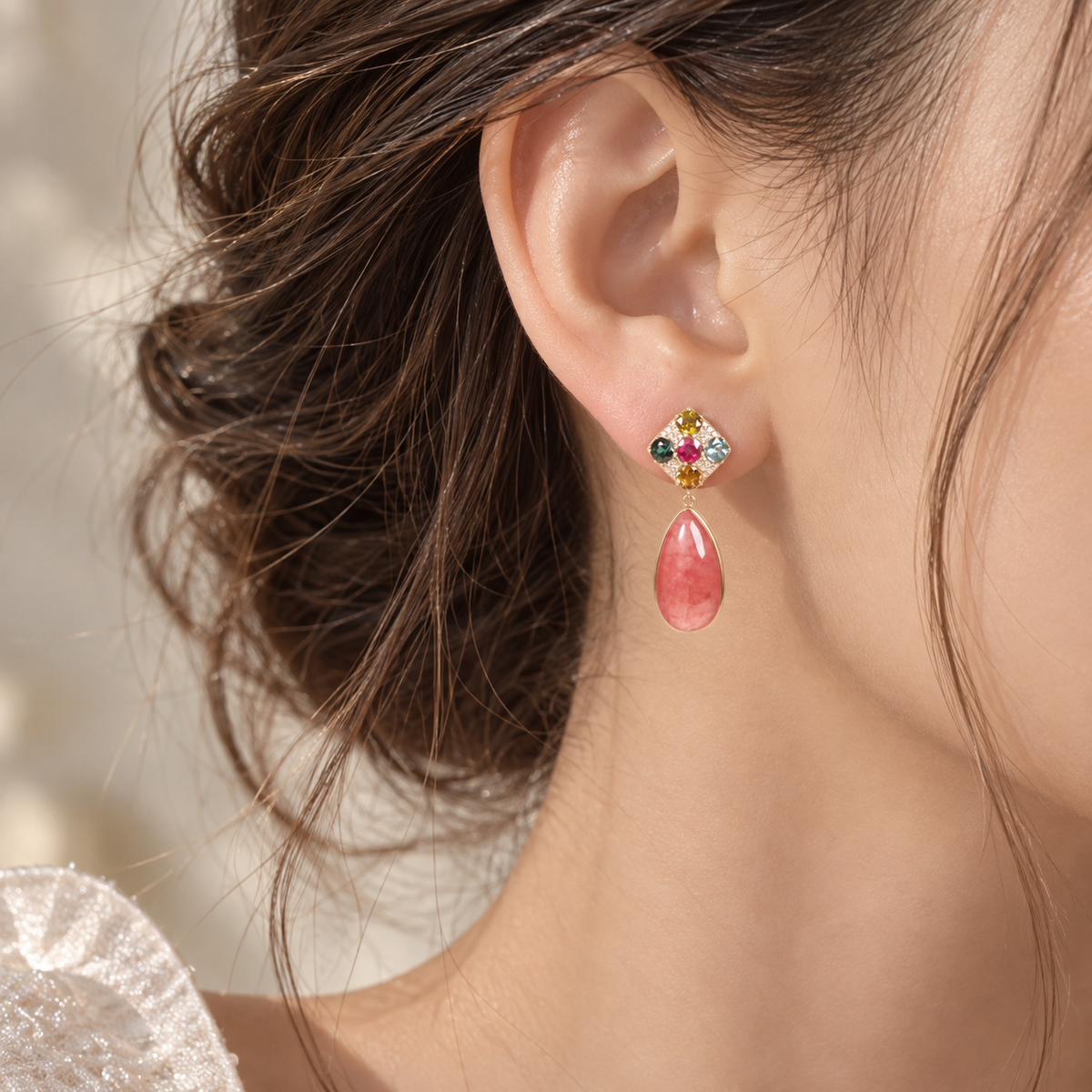 18K gold rhodochrosite drop earrings featuring pear-shaped pink rhodochrosite accented with colorful gemstones and sparkling natural diamonds.