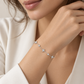 18K white gold natural diamond bracelet featuring alternating star-shaped diamond motifs and bezel-set round diamonds on a delicate chain.