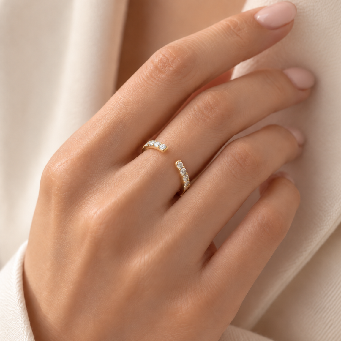18K gold open ring featuring round brilliant lab-grown diamonds set along both curved ends in a delicate modern design.