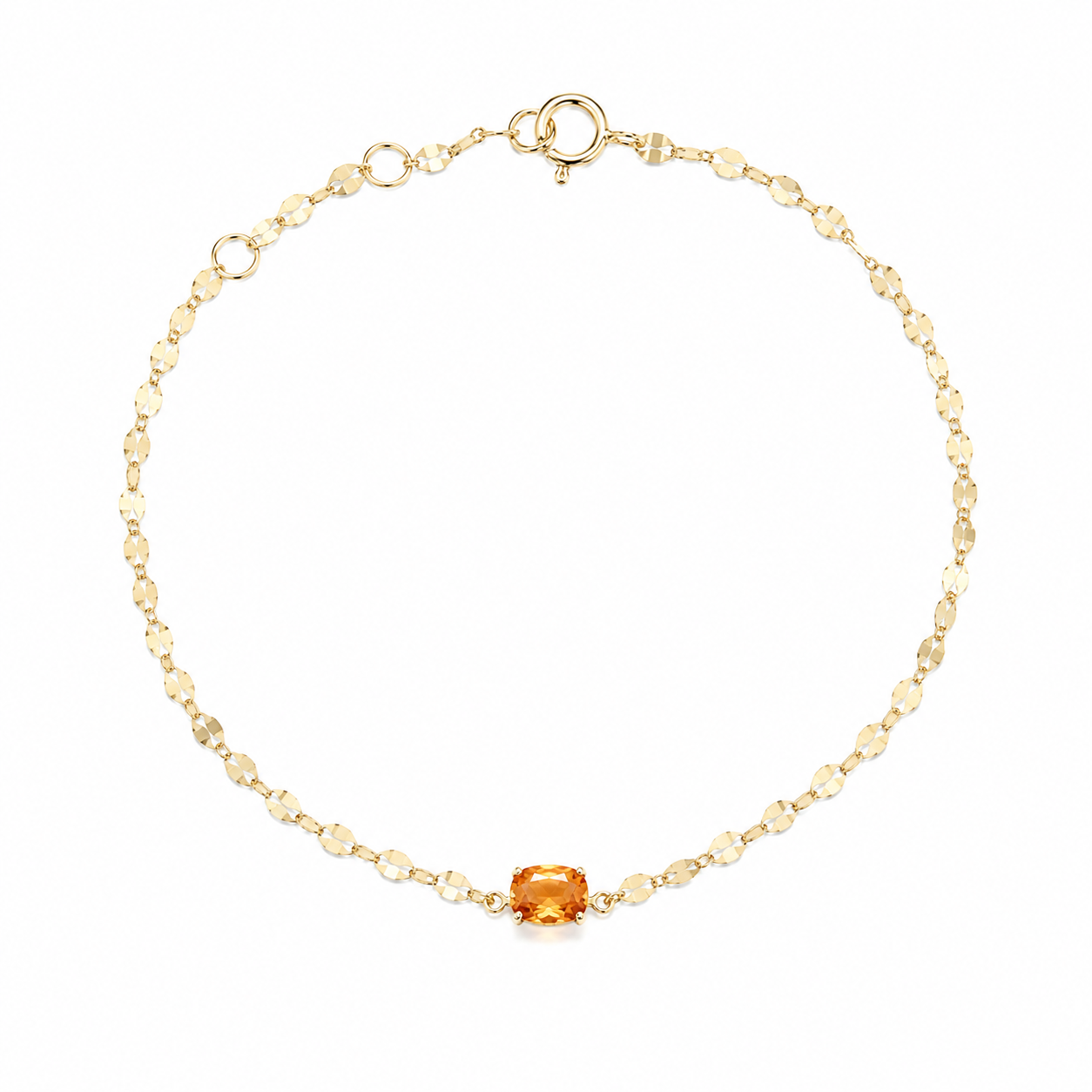 A delicate 18K yellow gold fine jewelry bracelet featuring a small, horizontally set natural fiery orange spessartine garnet center stone on a highly reflective sparkle chain against a solid white background.