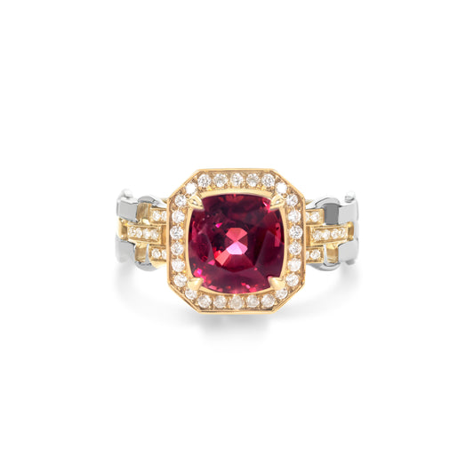 Red spinel and diamond halo Cuban link band ring crafted in 18K gold by Fantasilvia Fine Jewelry.
